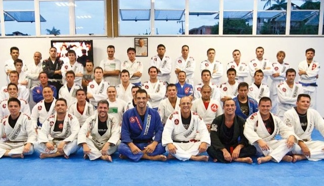 Professor Alexandre Marciano (in white) in front with his GB Joinville academy / Publicity photo Professor Alexandre Marciano (in white) in front with his GB Joinville academy / Publicity photo